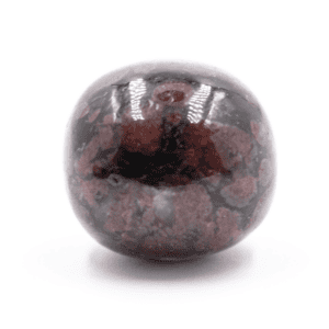 Antofylit s granátem - tromlovaný kámen